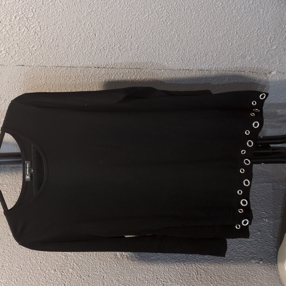 Black asymmetric tunic sweater with crystal detail at the bottom